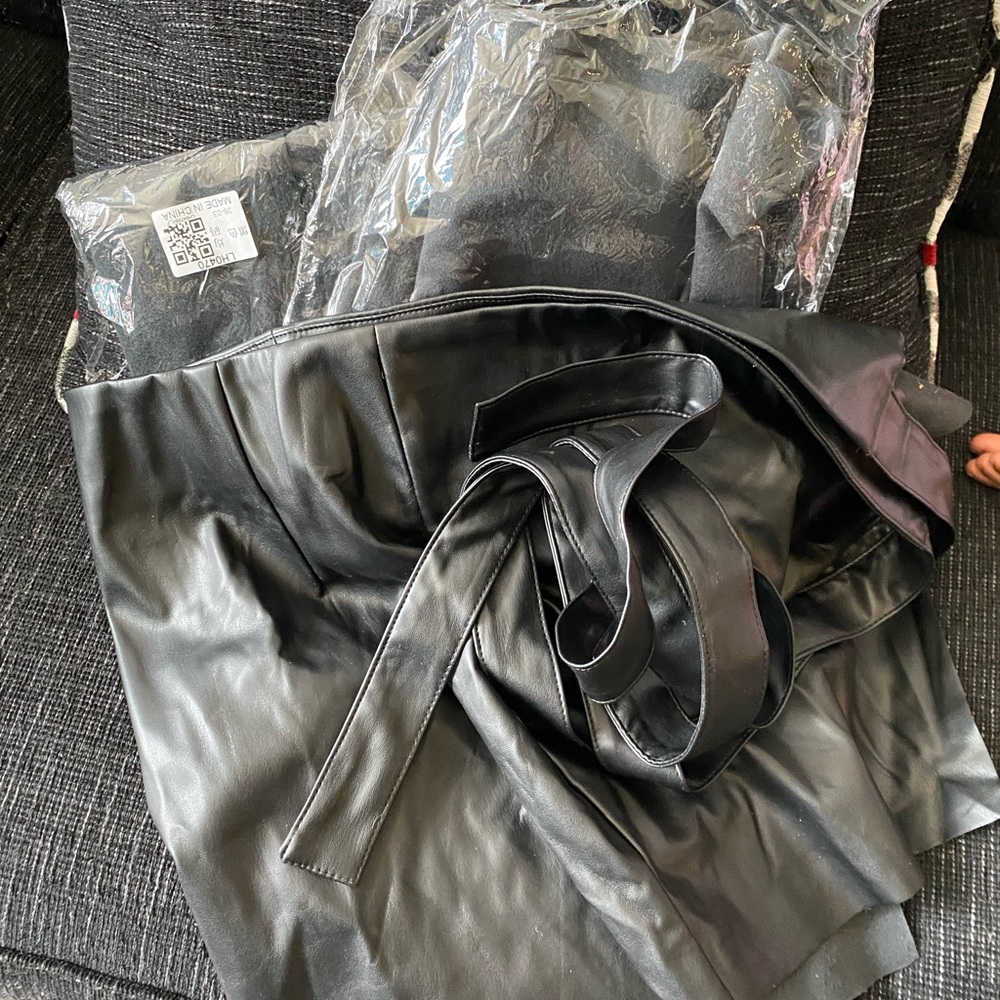 Black faux leather wrap miniskirt